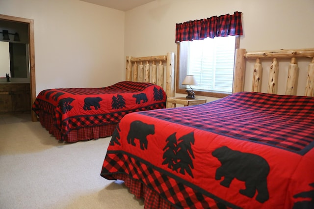 carpeted bedroom featuring connected bathroom