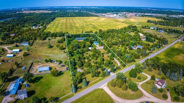 birds eye view of property with a rural view