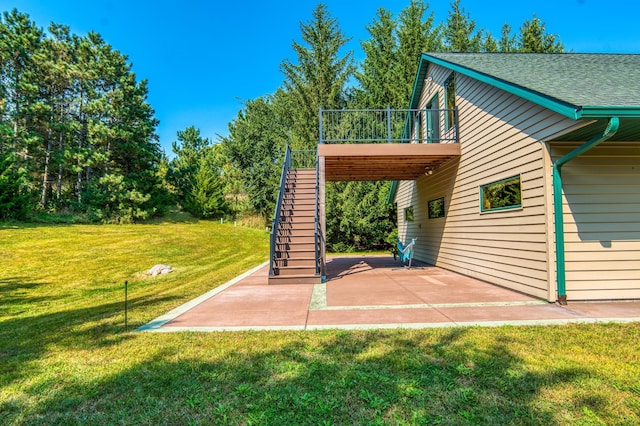 view of patio featuring a deck and stairway