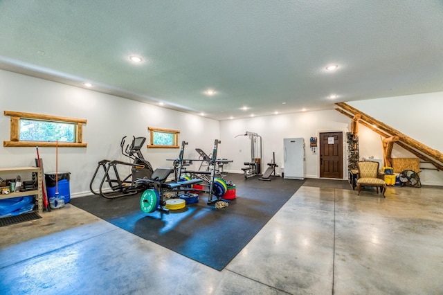 workout area with recessed lighting, baseboards, and a textured ceiling