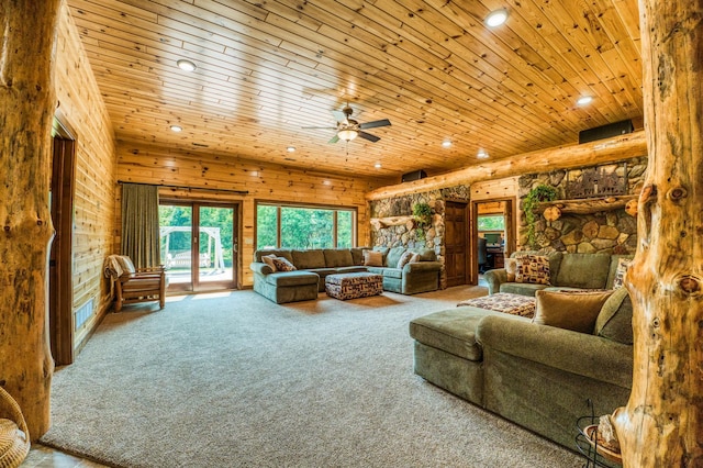 living area with recessed lighting, wooden walls, wood ceiling, and a ceiling fan