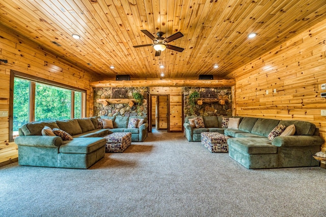 unfurnished living room featuring wood walls, wooden ceiling, carpet, and a ceiling fan