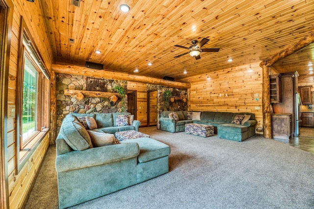 carpeted living area featuring recessed lighting, wood walls, wood ceiling, and a ceiling fan