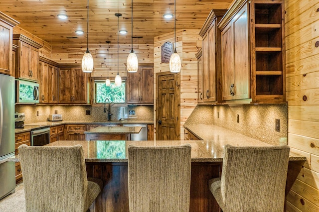 kitchen featuring light stone counters, open shelves, a sink, appliances with stainless steel finishes, and wooden ceiling