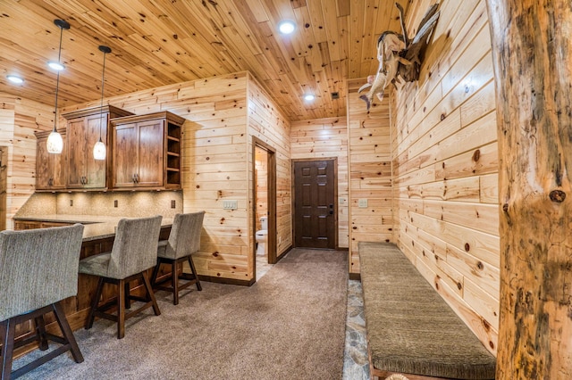 carpeted office space featuring recessed lighting, wooden ceiling, and wood walls