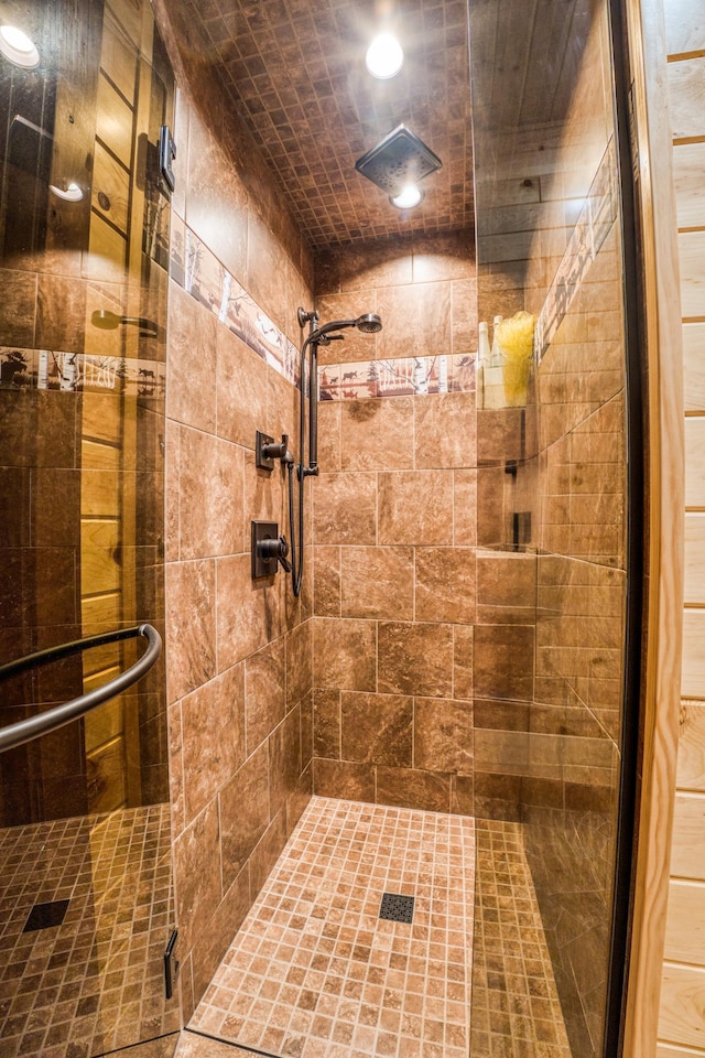 full bath with recessed lighting and a shower stall