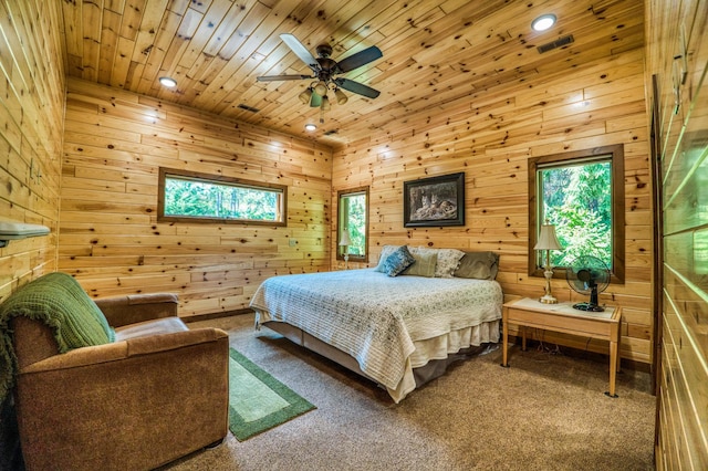 bedroom featuring recessed lighting, wooden ceiling, and carpet