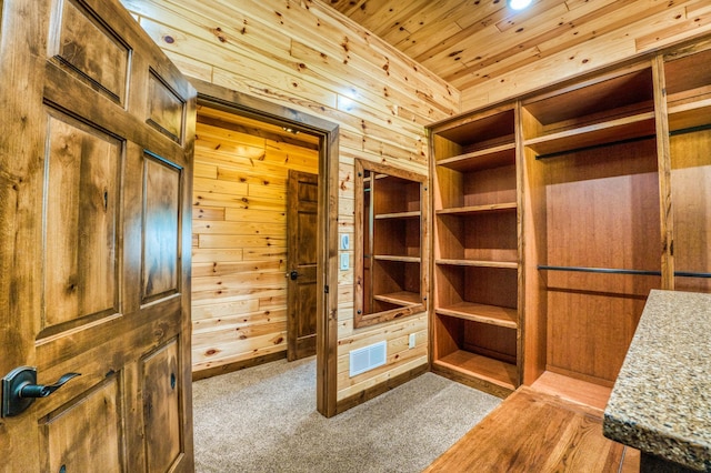 walk in closet featuring visible vents and carpet flooring