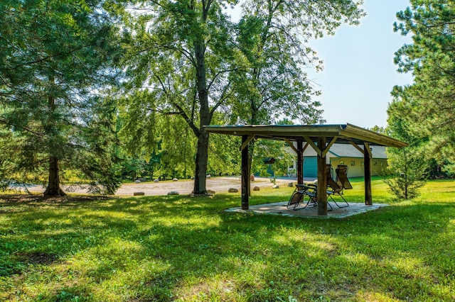 surrounding community with a gazebo and a yard