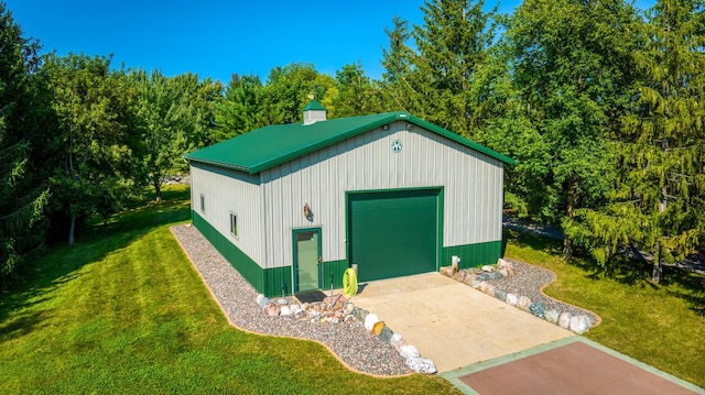 view of outbuilding featuring an outbuilding and concrete driveway