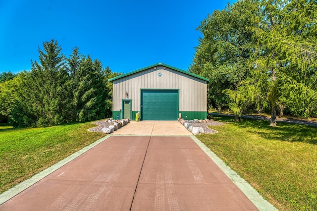 detached garage featuring driveway