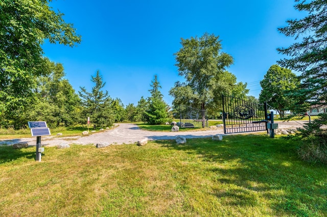 view of property's community featuring a yard