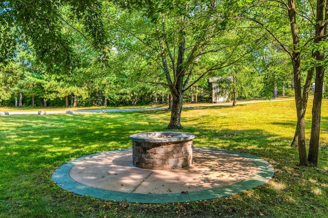 view of yard with a fire pit