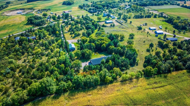 birds eye view of property with a rural view