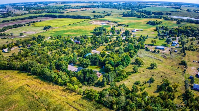 birds eye view of property with a rural view