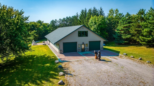 view of front of property with stone siding, an outdoor structure, a front lawn, and roof with shingles