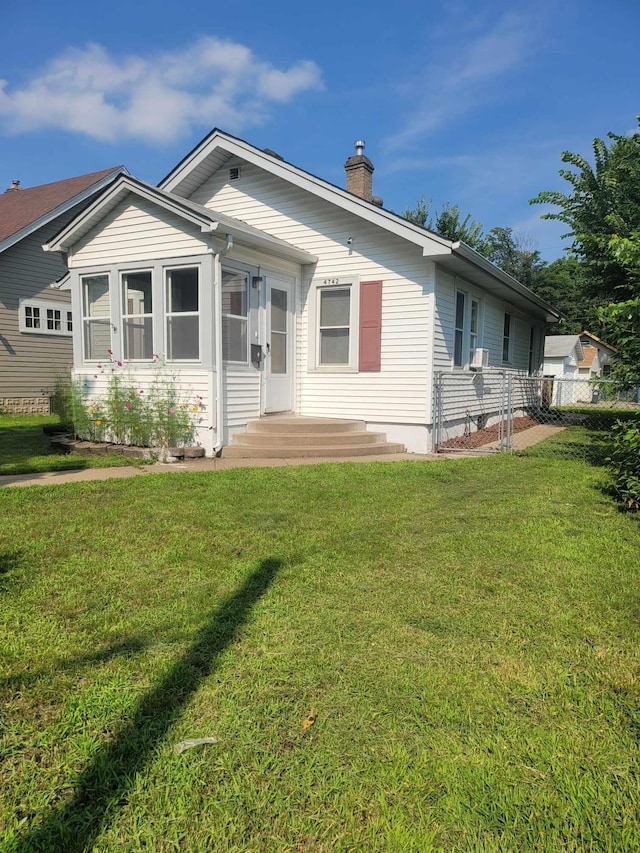 single story home with a front yard