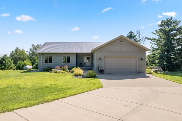 ranch-style home featuring a front lawn and a garage