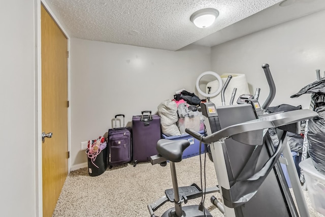 workout area with a textured ceiling