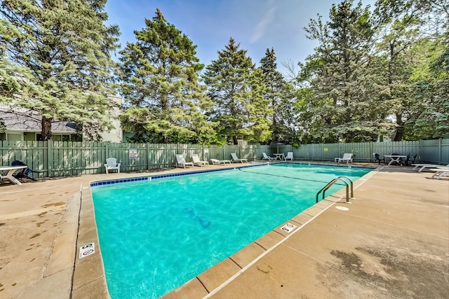 view of swimming pool featuring a patio