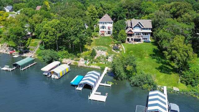 bird's eye view featuring a view of trees and a water view