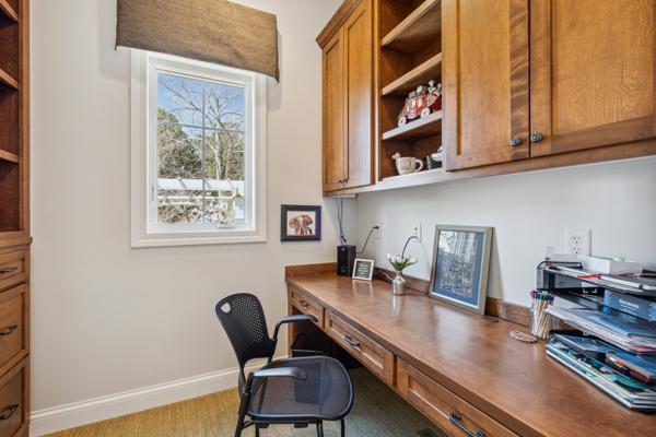 office featuring built in study area and baseboards