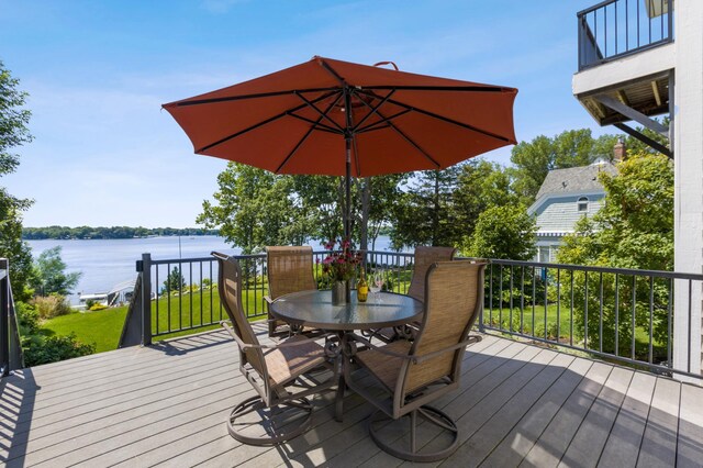 5115 Minneapolis Ave, Minnetrista, MN 55364 - wooden deck with outdoor dining space and a water view