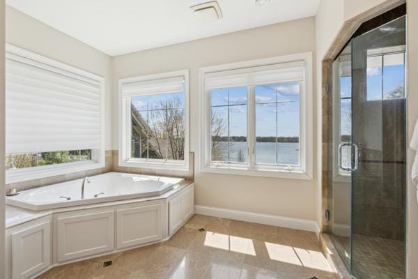 5115 Minneapolis Ave, Minnetrista, MN 55364 - bathroom with a bath, a shower stall, and baseboards