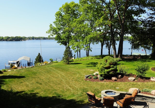 5115 Minneapolis Ave, Minnetrista, MN 55364 - view of green lawn featuring a water view and a fire pit