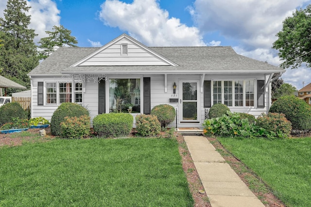 bungalow-style house featuring a front yard