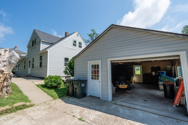 view of side of property with a garage