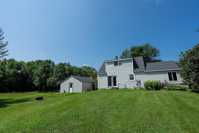 back of house with a yard