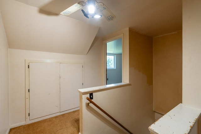 bonus room featuring lofted ceiling, light carpet, and ceiling fan