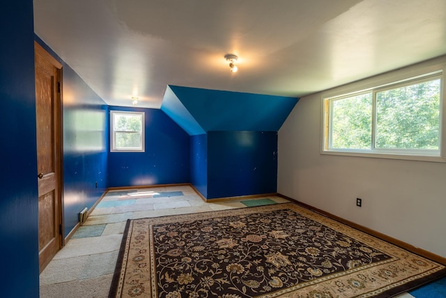 additional living space with vaulted ceiling