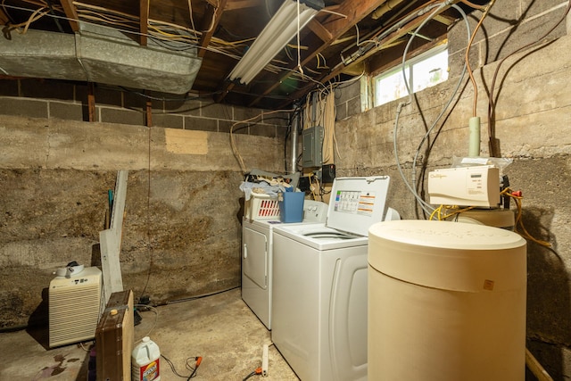 washroom featuring washing machine and clothes dryer and electric panel