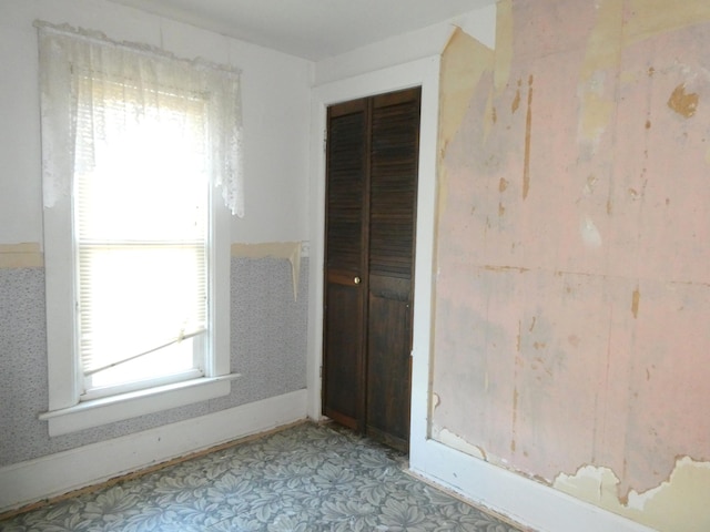 unfurnished bedroom with a closet