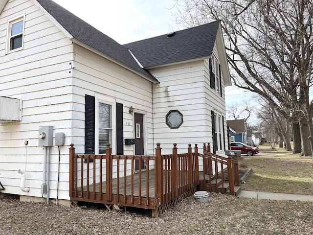 rear view of house with a wooden deck