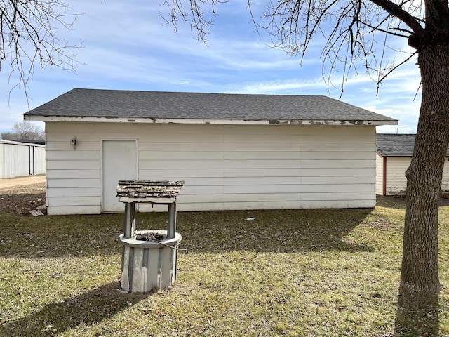 view of side of home with a lawn