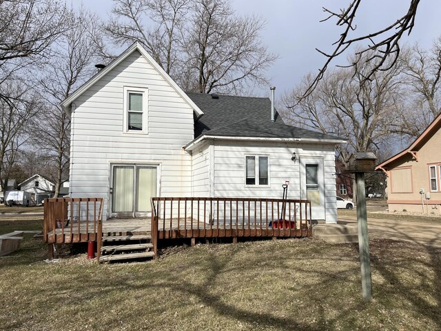 737 3rd Ave, Windom, MN 56101 - rear view of property with a wooden deck and roof with shingles