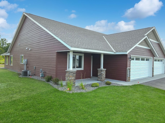 view of front facade with a front yard and a garage