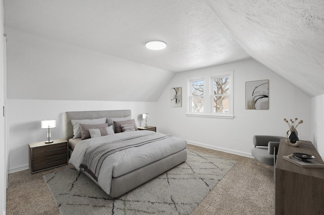 bedroom featuring baseboards, carpet floors, and a textured ceiling