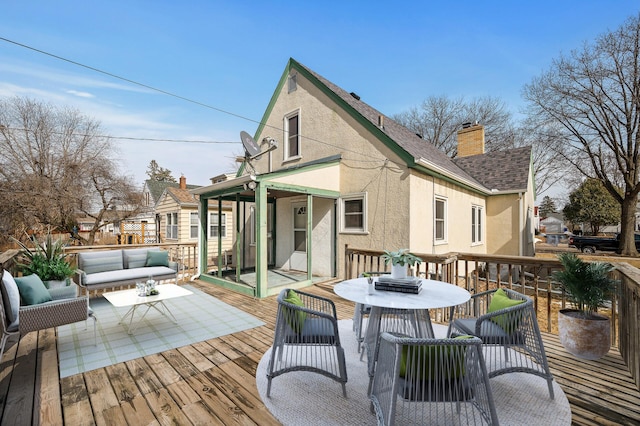 wooden terrace featuring outdoor lounge area