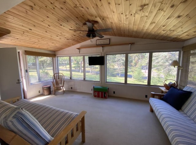 sunroom featuring ceiling fan, vaulted ceiling, and wood ceiling