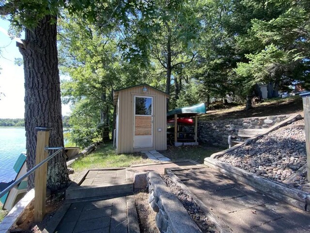 view of outbuilding featuring a water view