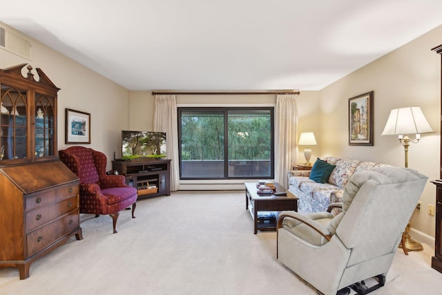 living room featuring baseboard heating and light colored carpet