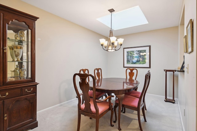 carpeted dining area featuring a skylight and a chandelier