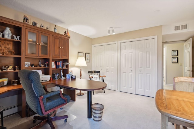 home office with light colored carpet