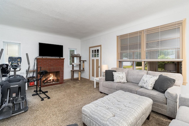 living room featuring a textured ceiling, a brick fireplace, and carpet floors