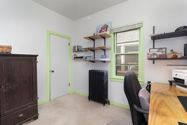 office area featuring light colored carpet and radiator heating unit