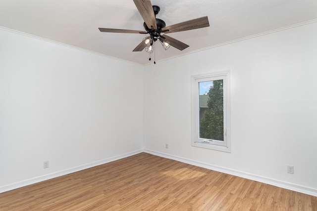 empty room with ceiling fan, light hardwood / wood-style flooring, and ornamental molding